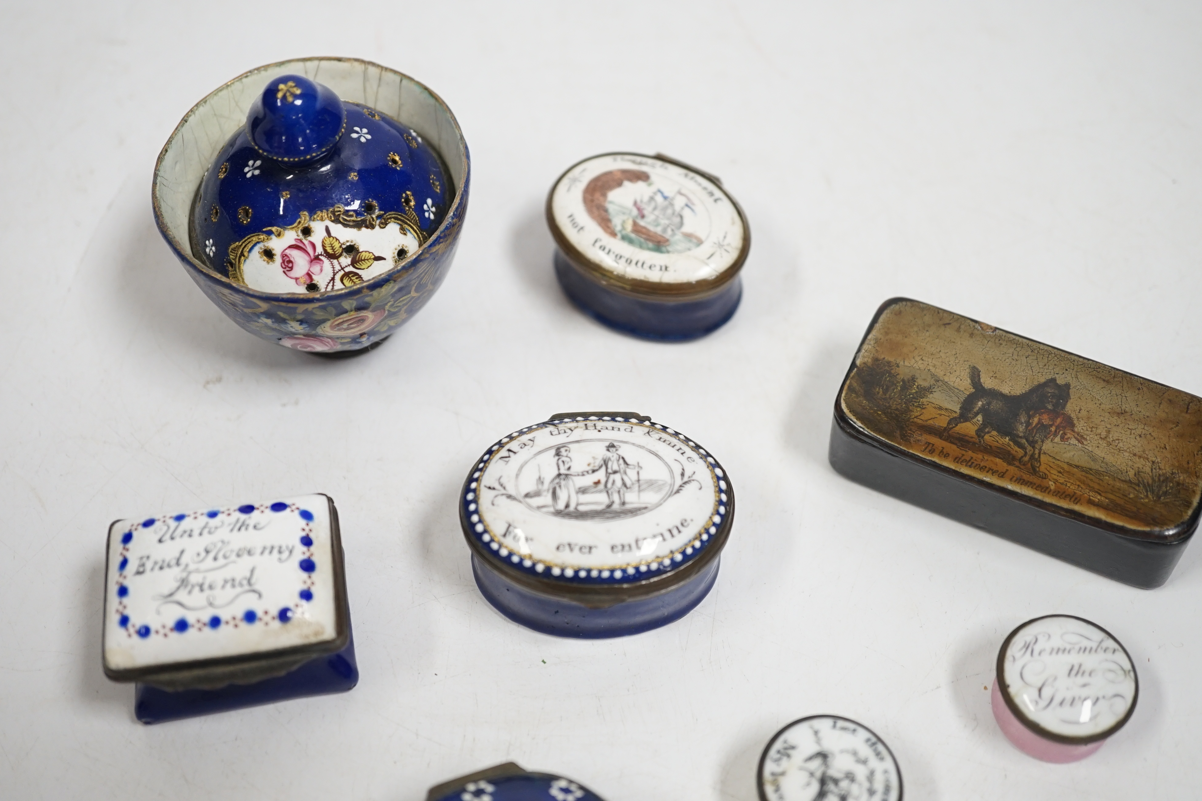 Two South Staffordshire enamel sweetheart patch boxes and two similar snuff boxes, three South Staffordshire enamel pill boxes, all late 18th/early 19th century, South Staffordshire enamel cup and associated cover and a